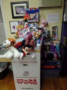 Box #1 of 2 overflowing with toys