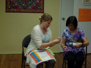 Kira teaching Hellen how to crochet