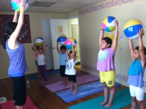 The children & Lucia in part 2 learning poses with their beach balls