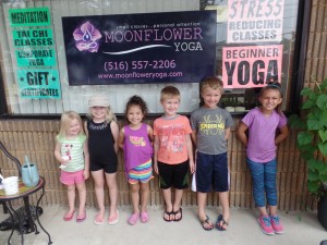 The children from part one on the front porch after class